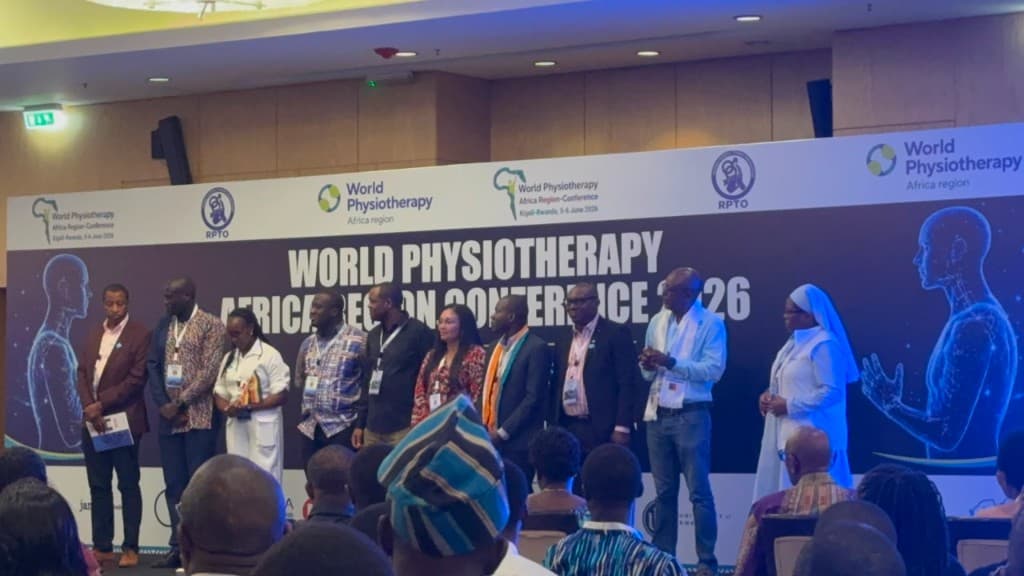CASP representatives on stage at the World Physiotherapy Africa Region Conference 2026 in Kigali, Rwanda
